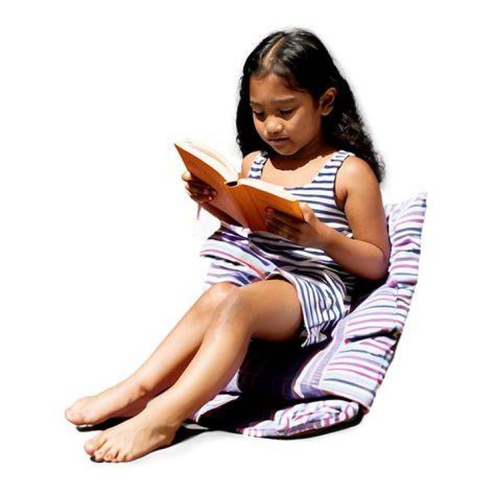 Gad reading a book during Storytime with Josh Gad show